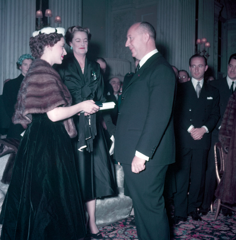 Christian Dior receiving honory membership of Red Cross from Princess Margaret, 3 November 1954