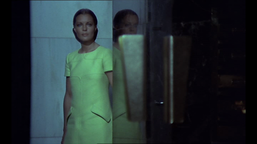 Romy Schneider Helene in film les choses de la vie 1970 wearing andre courreges green short sleeve dress standing beside the gate of her home