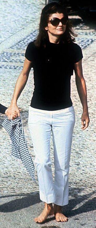 Elegant style icon wardrobe essentials: Jackie Kennedy Onassis in capri pants, with her son John Kennedy Jr., Capri, Italy