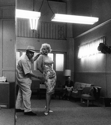 Orry-Kelly with Marilyn Monroe during a fitting for film Some Like It Hot