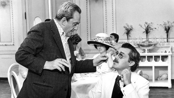 Luchino Visconti with British actor Dirk Bogarde while filming Death in Venice.