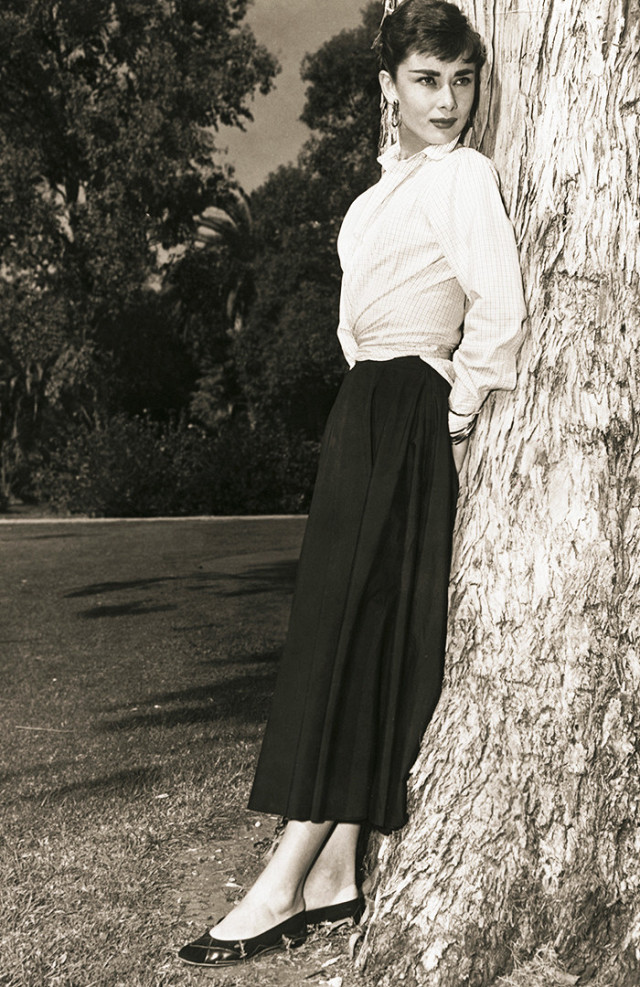 Audrey Hepburn ensemble of white long sleeve blouse and black a line skirt 