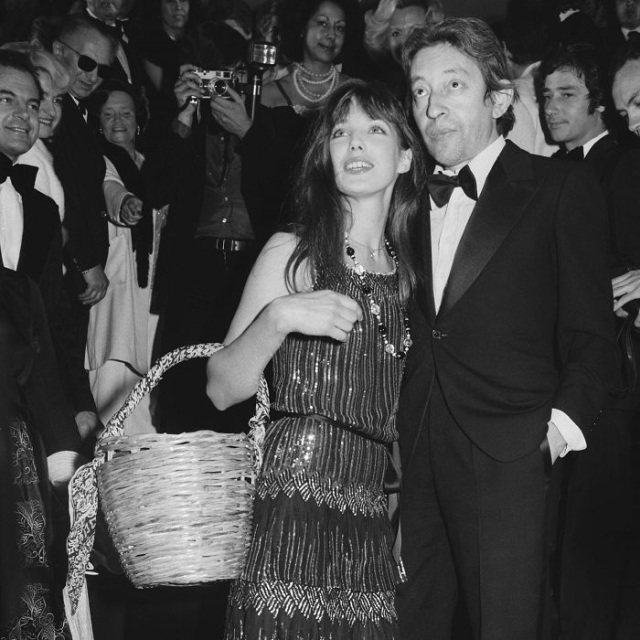 Jane Birkin carrying her omnipresent wicker basket, with Serge Gainsbourg