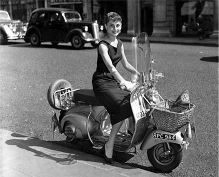Audrey Hepburn in little black dress on site of film Roman Holiday 1952