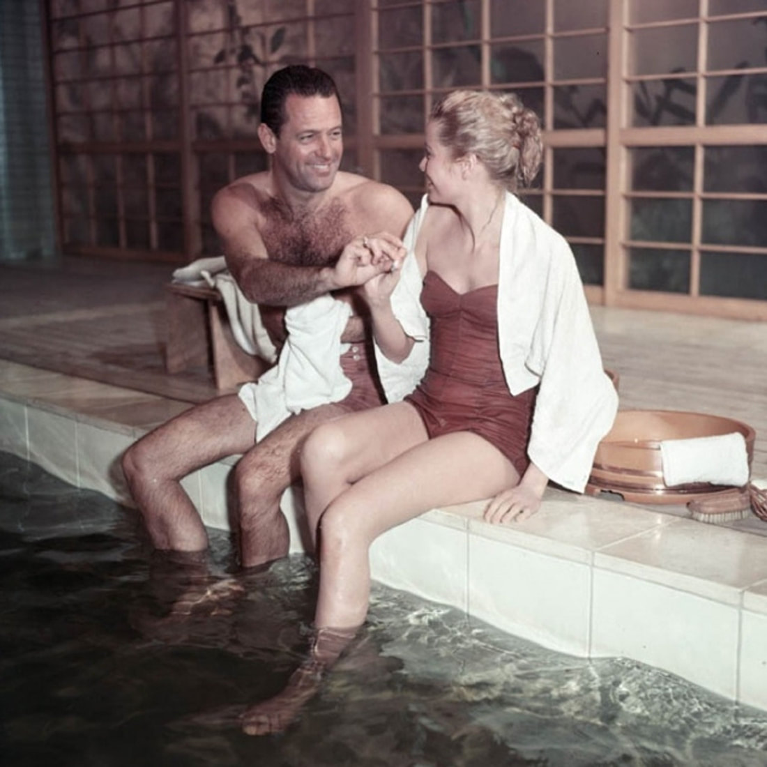 Elegant style icon wardrobe essentials: Grace Kelly in swimwear, a strapless one piece swimming suit, in film The Bridges at Toko-Ri(1954)