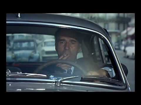 Michel Piccoli as Pierre in his car smoking meditative