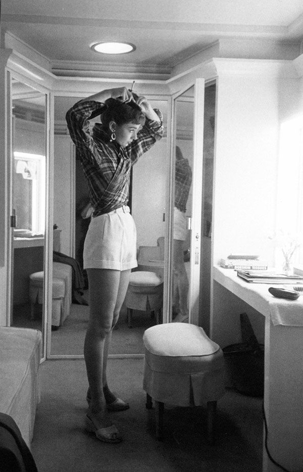 Audrey Hepburn in check blouse on site of film Sabrina(1954)
