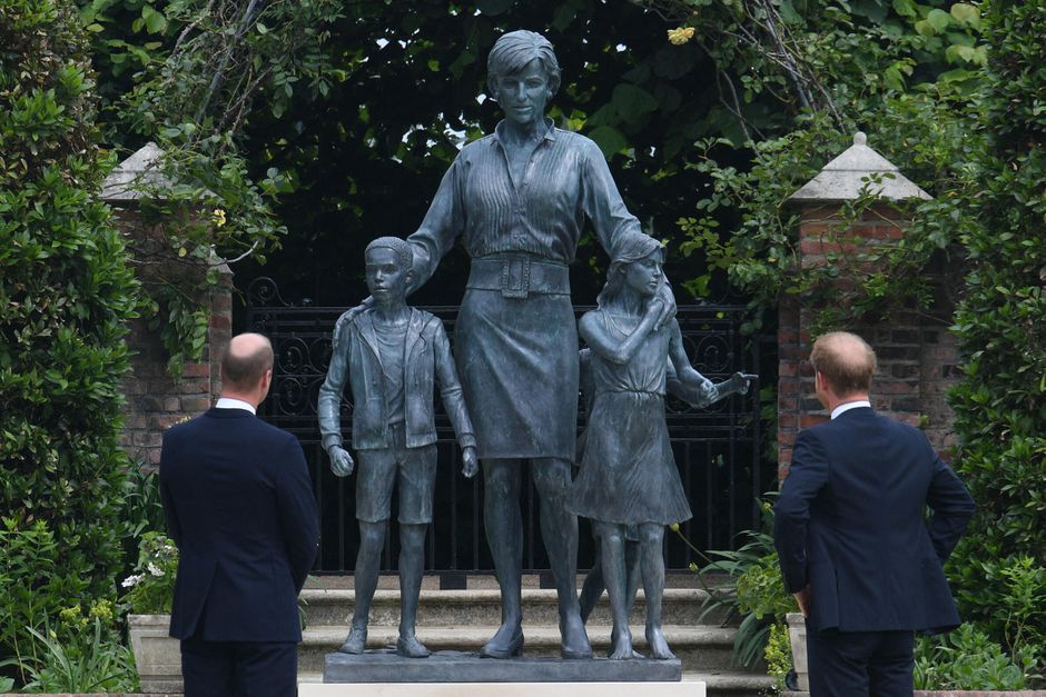 Prince William and Prince Harry unveil a statue of their mother Princess Diana in Kensington Garden