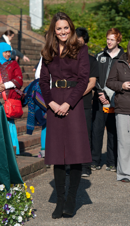 Kate Middleton wore an aubergine wool coat with funnel neck tailored by an independent dressmaker on 10 October 2012