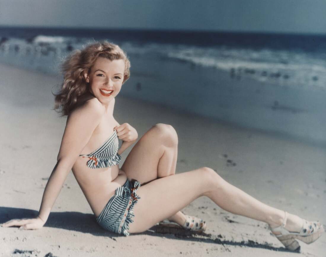 Elegant style icon wardrobe essentials: Marilyn Monroe in swimwear, a two piece strapless bikini
