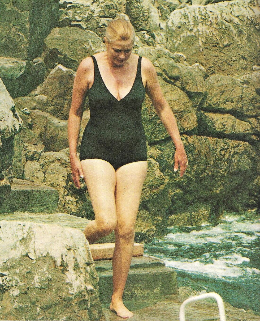 Elegant style icon wardrobe essentials: Grace Kelly in swimwear, a one piece black swimming suit
