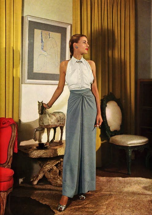 A model in a white sleeveless shirt with grey pants, Vogue, 1944, photo by John Rawlings(1912-1979)