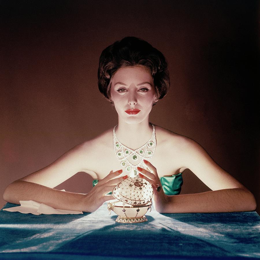 A model illuminated by a faberge egg, photo by John Rawlings(1912-1979)