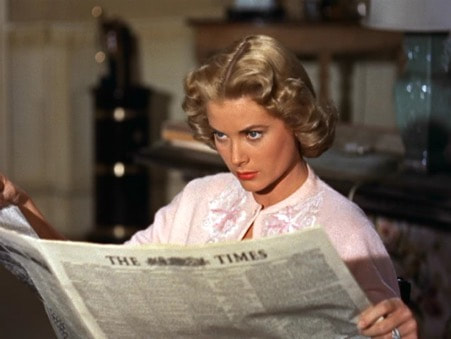 Elegant style icon wardrobe essentials: Grace Kelly in cardigan sweater: Grace Kelly wearing a pink cashmere cardigan sweater in film Dial M for Murder(1954)