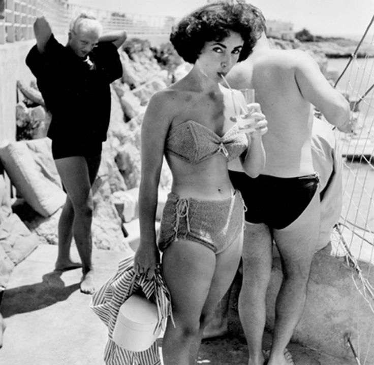 Elegant style icon wardrobe essentials: Elizabeth Taylor in swimwear, a two piece bikini