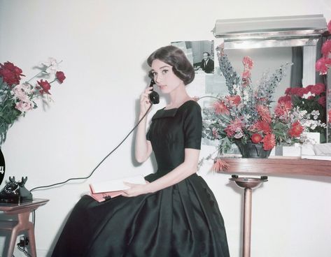 Elegant style icon wardrobe essentials: Audrey Hepburn in little black dress: Audrey Hepburn in black dress on the set of film Funny Face(1957)