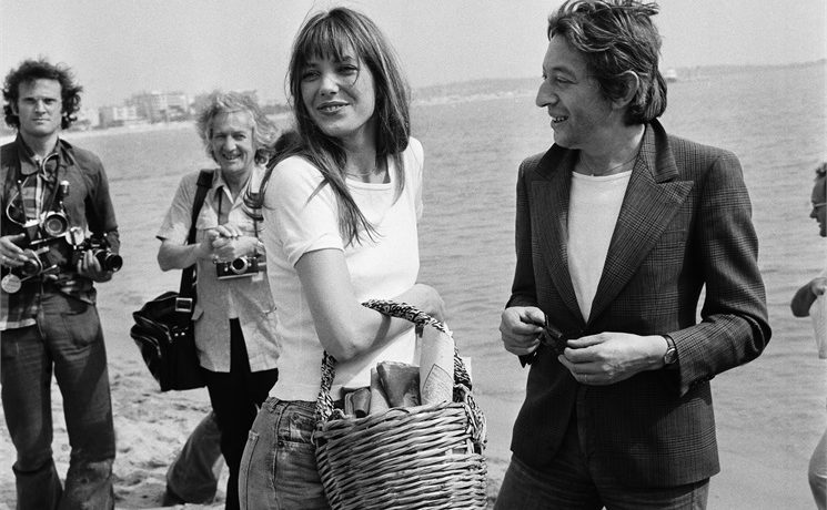 Jane Birkin carrying her omnipresent wicker basket, with Serge Gainsbourg