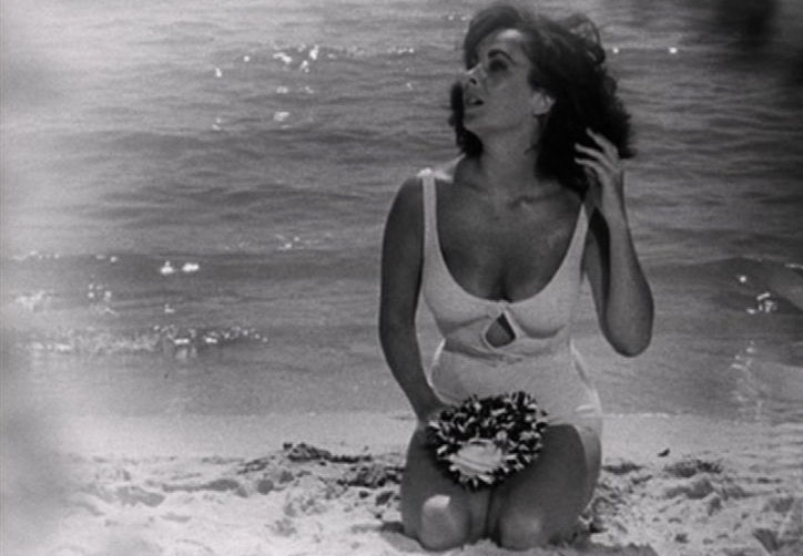 Elegant style icon wardrobe essentials: Elizabeth Taylor in swimwear, a white one piece swimsuit, in film Suddenly Last Summer(1959)