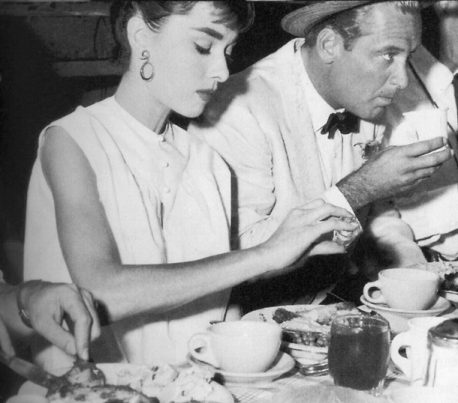  Audrey Hepburn in sleeveless, white blouse on site of film Sabrina, 1954