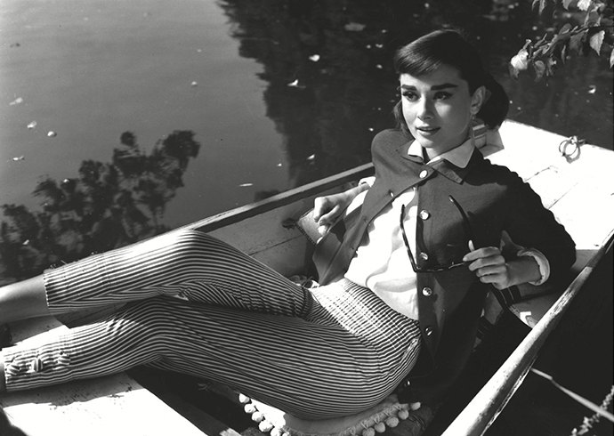 Elegant style icon wardrobe essentials: Audrey Hepburn in cardigan sweater in film Love in the Afternoon