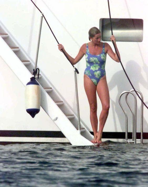 Elegant style icon wardrobe essentials: Princess Diana in swimwear, a one piece swimsuit with floral print