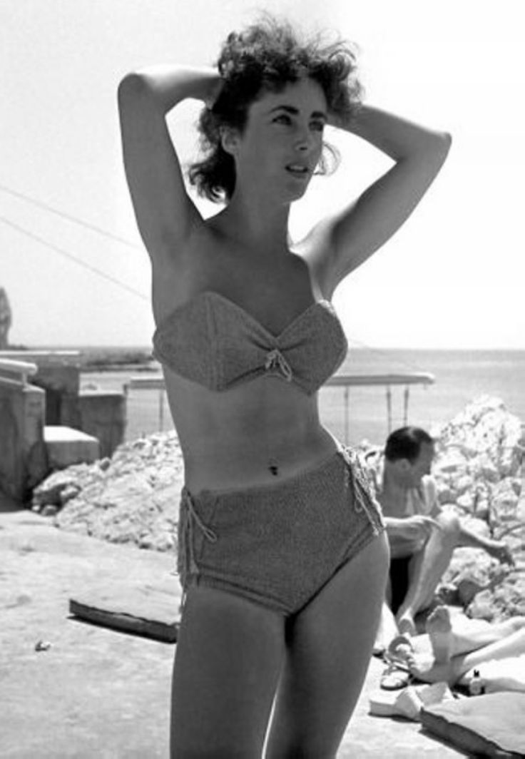 Elegant style icon wardrobe essentials: Elizabeth Taylor in swimwear, a two piece bikini