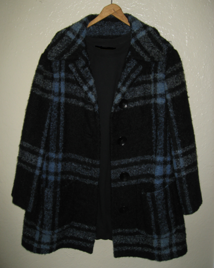 Three-quarters-length jacket of a woolen suit designed by Guy Laroche in the late 1950s or very early 1960s that included a black skirt and blouse.