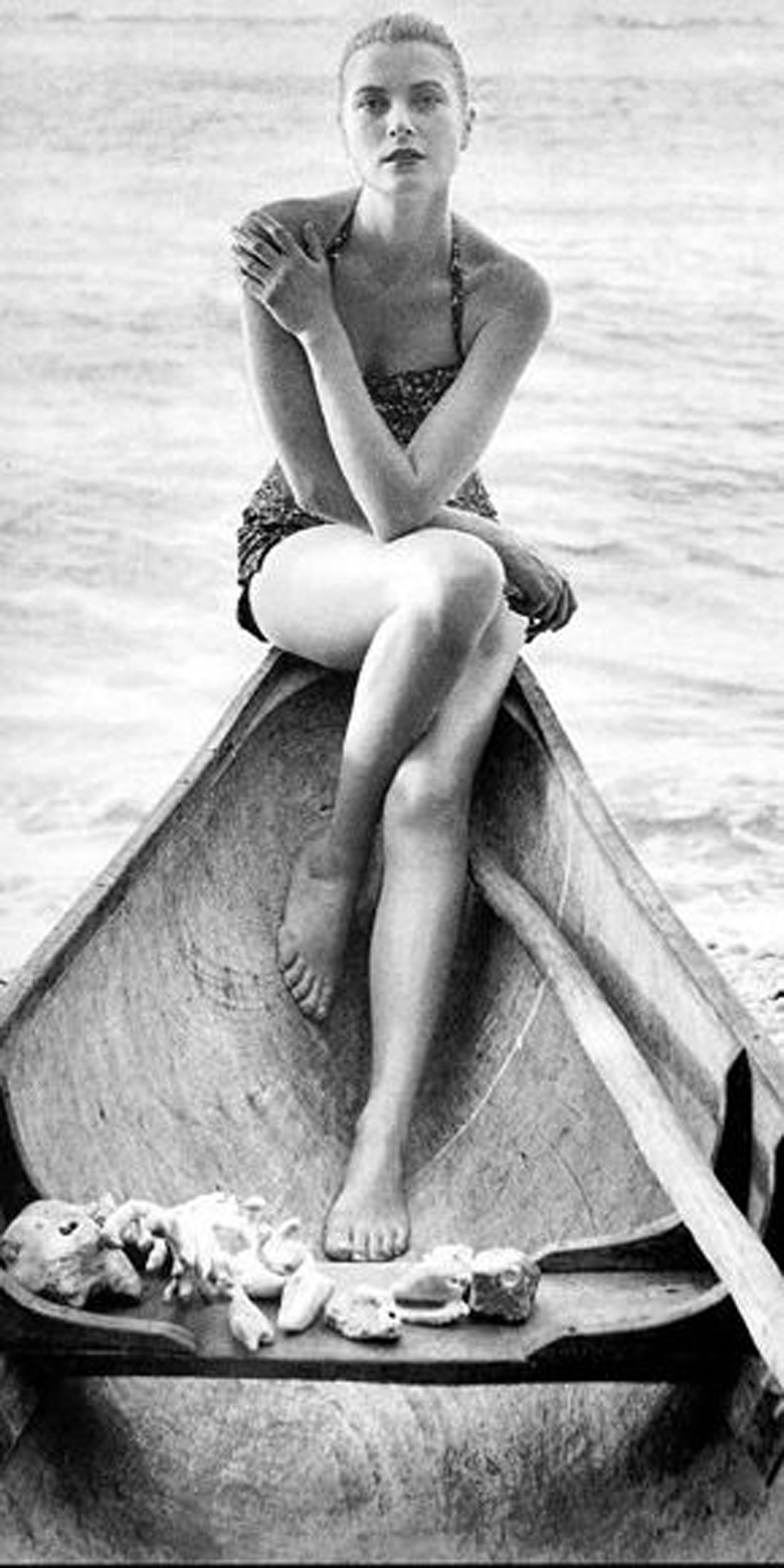 Elegant style icon wardrobe essentials: Grace Kelly in swimwear, a halter neck printed one piece swimming suit