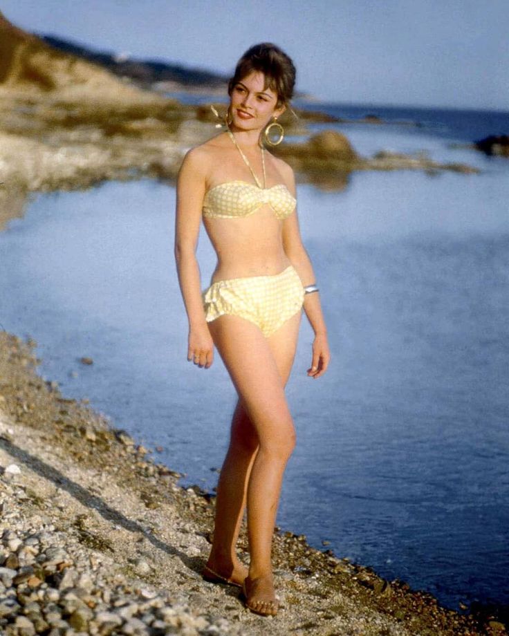 Elegant style icon wardrobe essentials: Brigitte Bardot in swimwear, a two piece bikini in polka dot print
