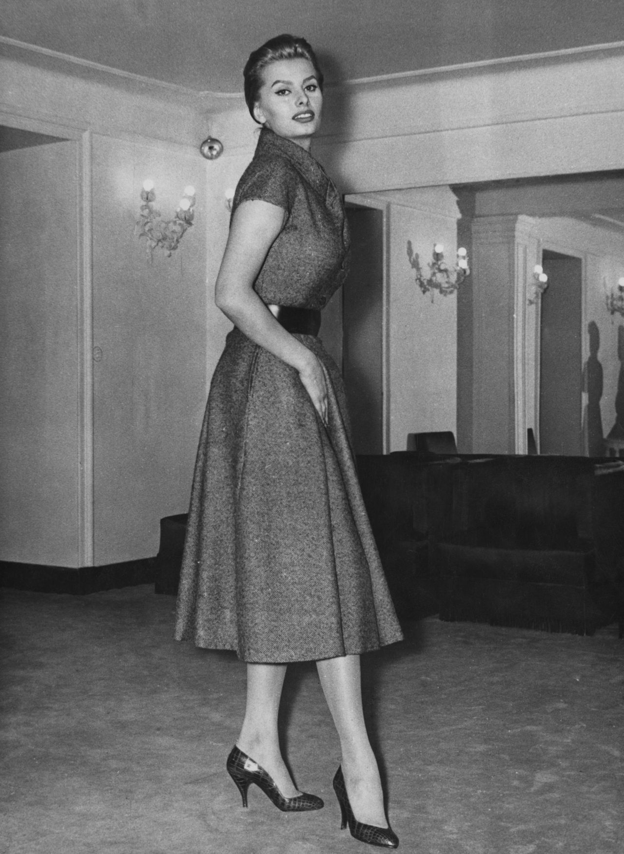 Sophia Loren in a dress made by Battilocchi of Rome, in a store in Rome, Italy on February 6, 1956