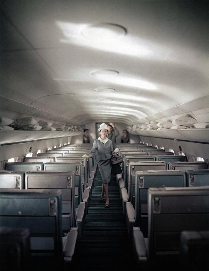 Model Walking Down An Airplane Aisle, photo by John Rawlings(1912-1979)