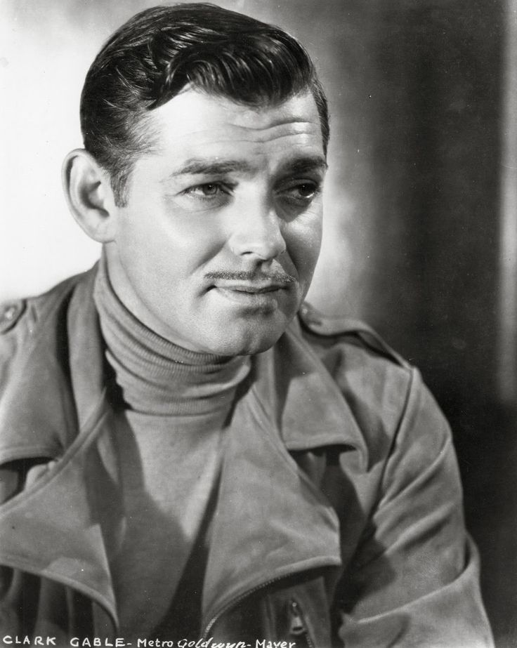 Clark Gable in turtleneck sweater with wide lapeled overcoat