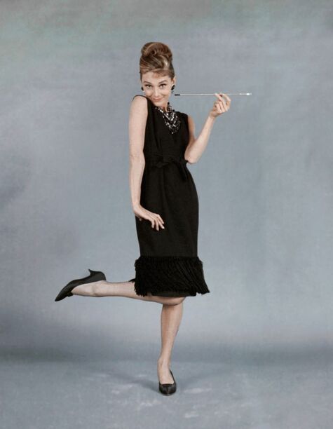 Elegant style icon wardrobe essentials: Audrey Hepburn in little black dress designed by Hubert de Givenchy, in film Breakfast at Tiffany's(1961)