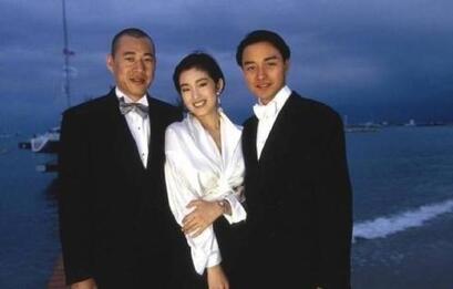 Elegant style icon wardrobe essentials: Gongli(鞏俐)in white shirt:Gong Li in white shirt, Cannes, France, 1993: Gong Li in white shirt with Chinese actor Zhang Fengyi and Hongkong actor Leslie Cheung, Cannes, France, 1993