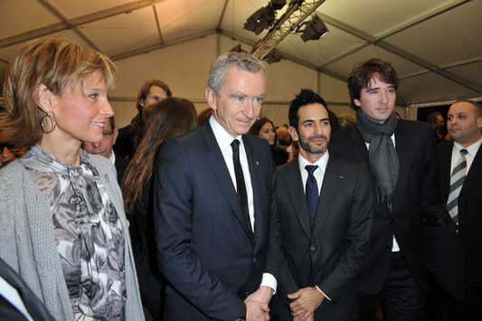 Bernard Arnault with his wife Helene Arnault, his son Antoine Arnault  and Designer Marc Jacobs backstage during the Louis Vuitton Ready to Wear show as part of the Paris Womenswear Fashion Week Fall/Winter 2011 at Cour Carree du Louvre on March 10, 2010 in Paris, France.