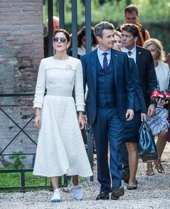 Princess Mary wore a custom white long-sleeved tweed dress by Danish designer Mark Kenly Domino Tan, with Nike’s white VaporMax Explorer low-tops