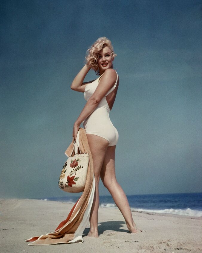 Elegant style icon wardrobe essentials: Marilyn Monroe in swimwear, a one piece white bathing swimming suit