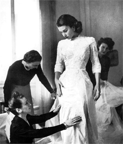 Linda Christian tried on her wedding wedding gown, by Sorella Fontana, before her wedding to Tyrone Power, Rome, Italy, 1949