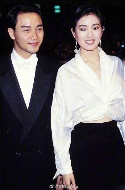 Elegant style icon wardrobe essentials: Gongli(鞏俐)in white shirt:Gong Li in white shirt, Cannes, France, 1993:Gong Li in white shirt with Hongkong actor Leslie Cheung, Cannes, France, 1993