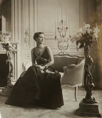 Wallis Simpson, Duchess of Windsor style: Wallis Simpson in a crossed v neck evening gown circa 1930