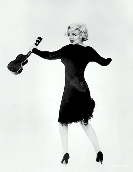 Marilyn Monroe in film Some Like It Hot(1959) wearing black dress designed by Orry Kelly