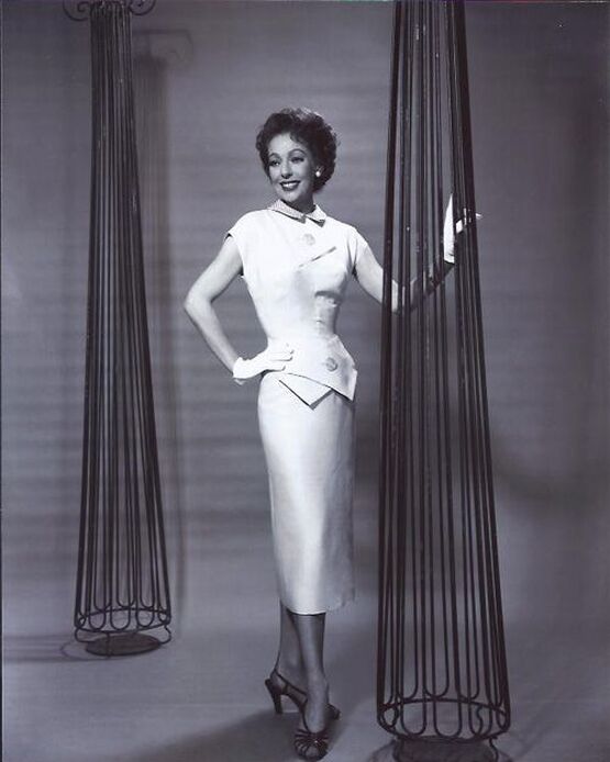 Loretta Young wearing a dress designed by Jean Louis