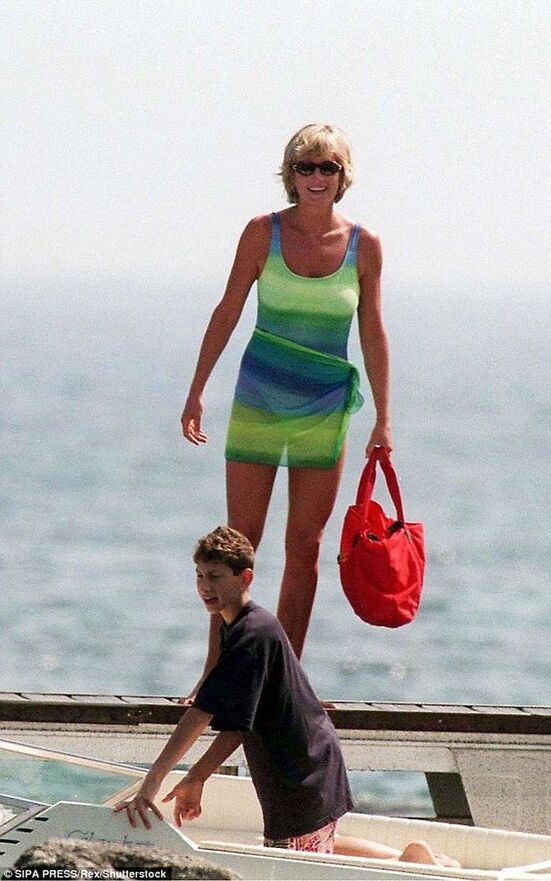 Elegant style icon wardrobe essentials: Princess Diana in swimwear, a one piece swimsuit with neon green and blue print