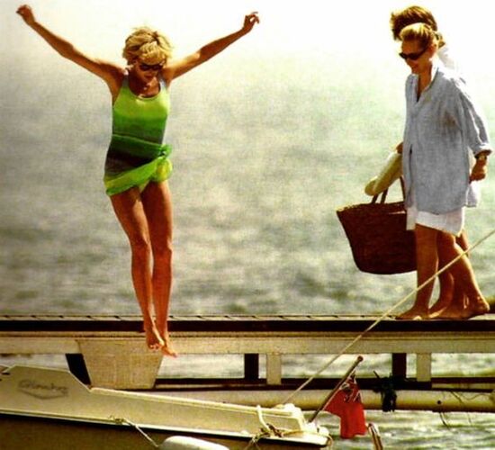 Elegant style icon wardrobe essentials: Princess Diana in swimwear, a one piece swimsuit with neon green and blue print