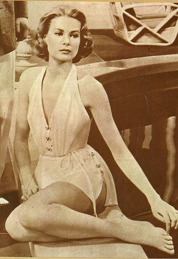 Elegant style icon wardrobe essentials: Grace Kelly in swimwear, a halter neck one piece swimming suit, in film High Society