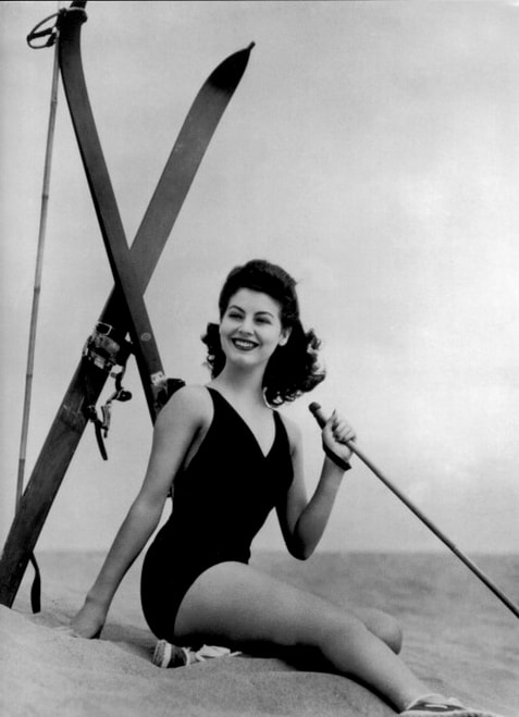 Elegant style icon wardrobe essentials: Ava Gardner in swimwear, a one piece swimsuit in solid color