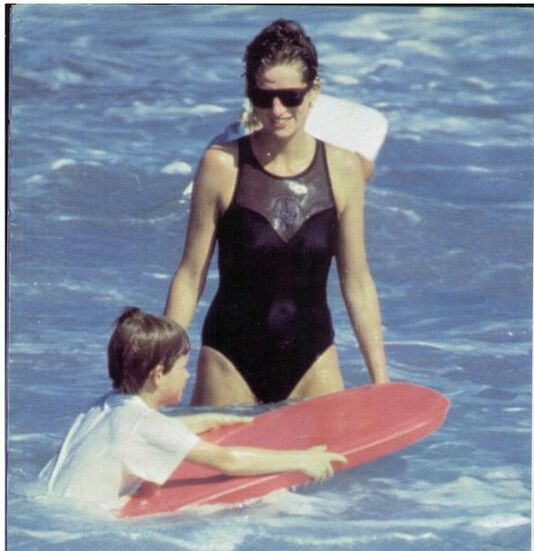 Elegant style icon wardrobe essentials: Princess Diana in swimwear, a one piece black swimsuit