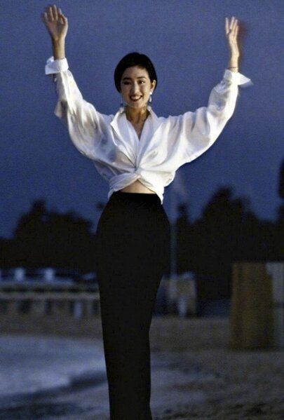 Elegant style icon wardrobe essentials: Gongli(鞏俐)in white shirt:Gong Li in white shirt, Cannes, France, 1993