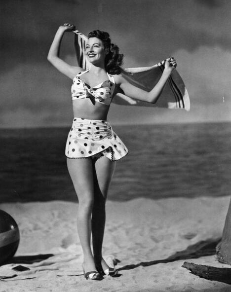 Elegant style icon wardrobe essentials: Ava Gardner in swimwear, a three piece bikini in polka dot print