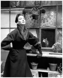 Most elegant model Dorian Leigh in a wool velvet coat with mink collar and cuffs by Pierre Balmain for ELLE, August 31, 1953, photo by Georges Dambier